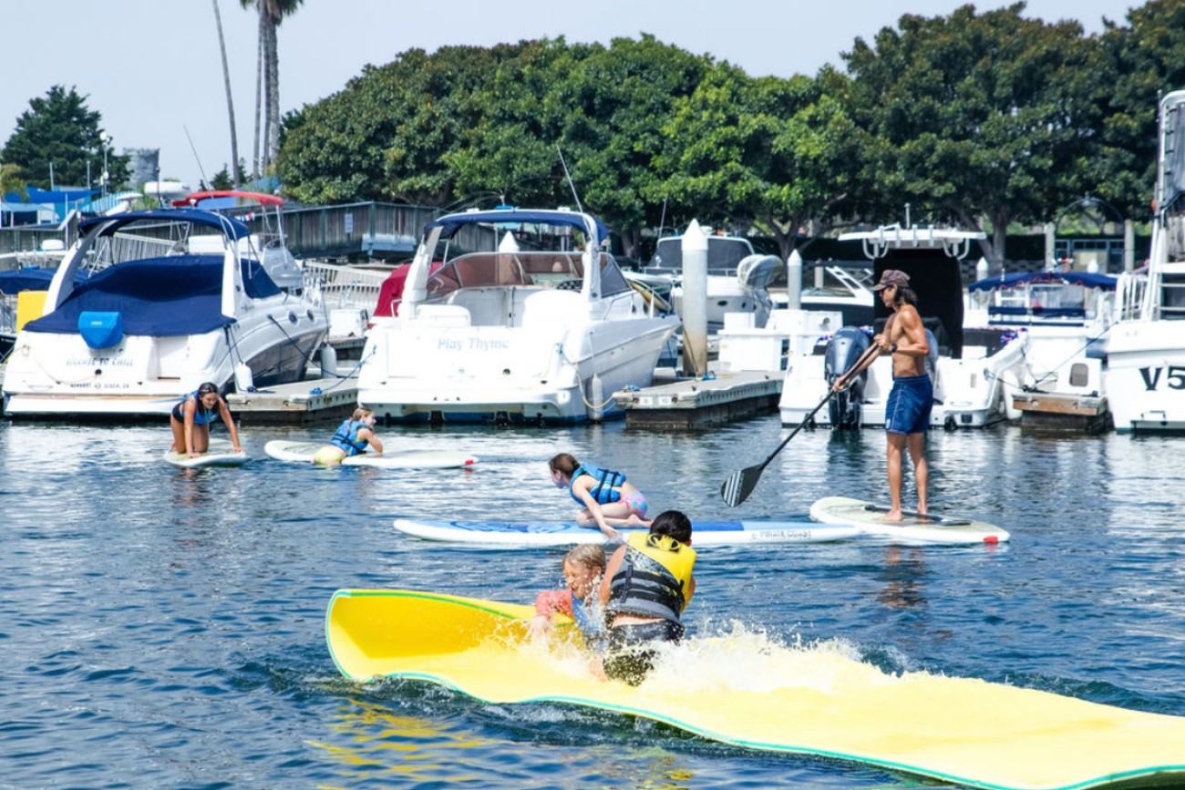 Kids paddle board summer camp in Newport Beach